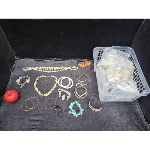 1006 - A basket containing an assortment of vintage costume jewellery including necklaces and bracelets. Ap... 