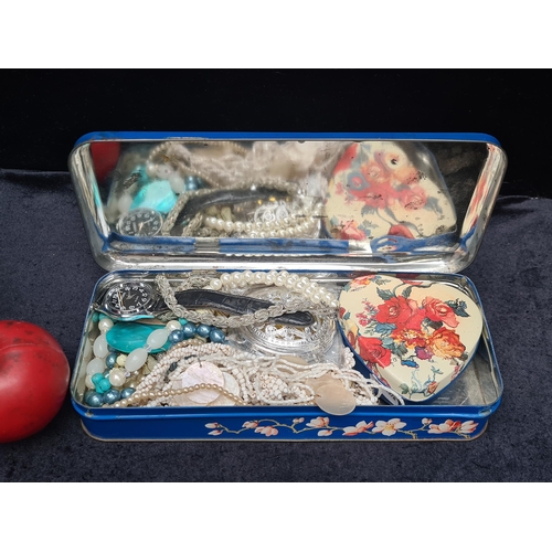 1007 - A tin containing an assortment of costume jewellery including bracelets, a Xuebin gentleman's wrist ... 