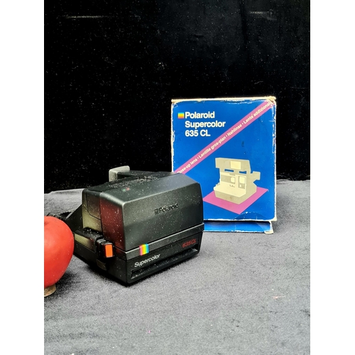 1008 - A Polaroid Supercolor camera 635 Cl. C.1986-1992.  Comes with original box and manual.