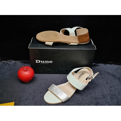 1025 - An as new pair of ladies Dune open toed sandals with small block heel in original box. Size EU38.