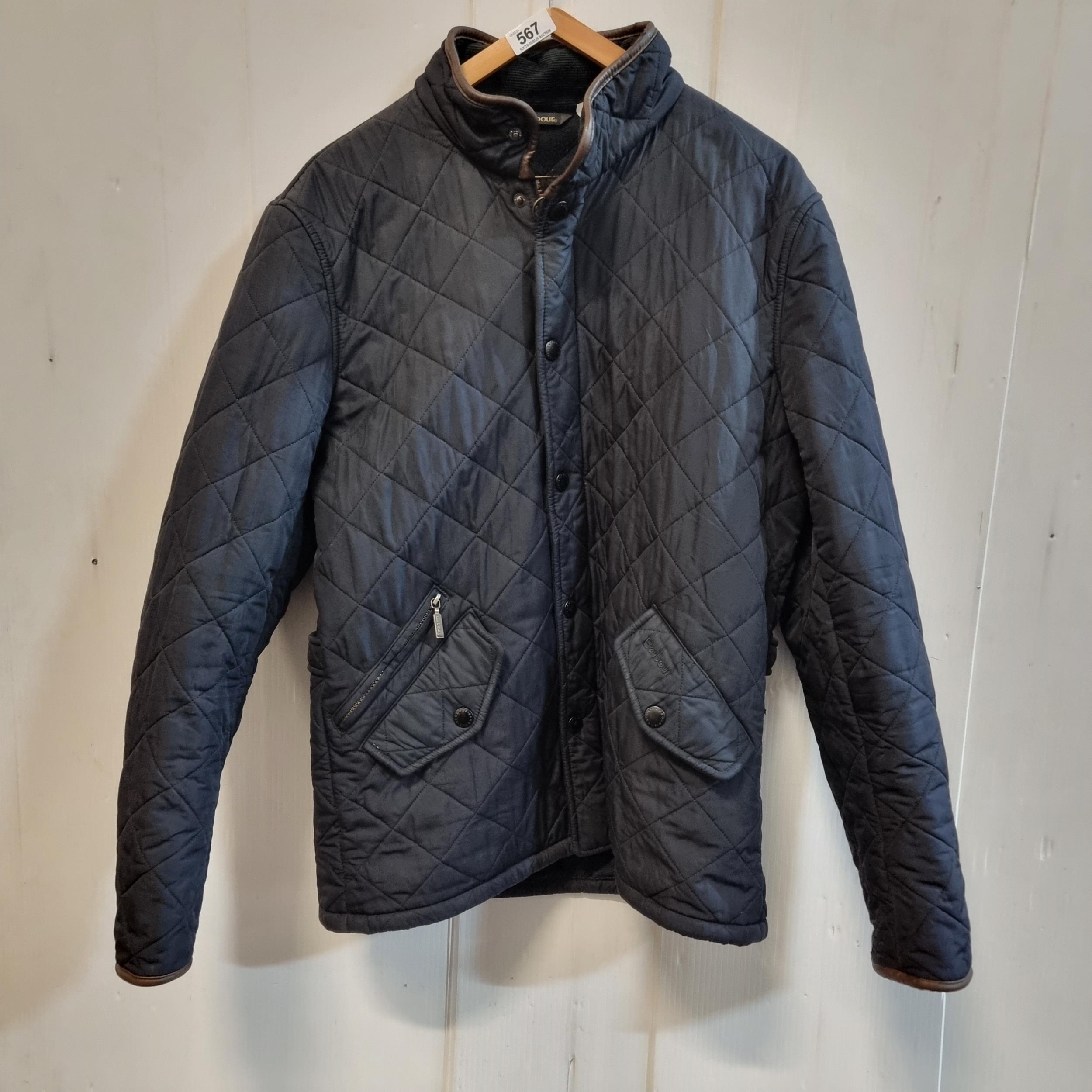 A designer Barbour quilted jacket in navy, with corduroy collar. Unisex ...