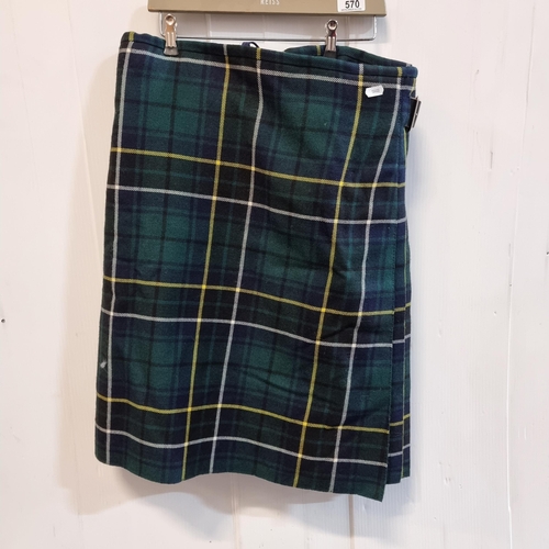 570 - A fantastic Scottish kilt made by Burnett's, in a green, navy and yellow tartan pattern with leather... 