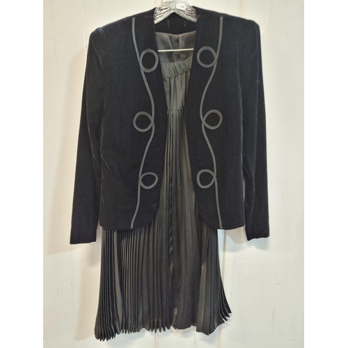 575 - A lovely velvet jacket with padded shoulders and brocade detail along with along with a pleated unde... 