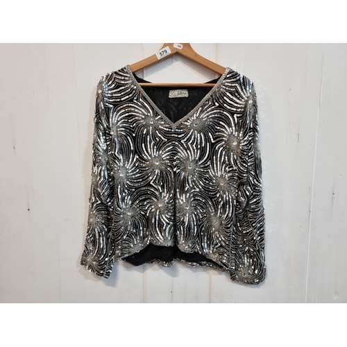 579 - A glamorous vintage sequined evening top, in a fire work pattern. By the brand Sitara. To fit a UK w... 