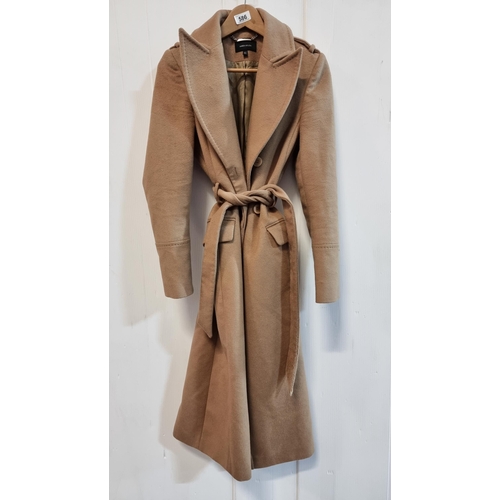 586 - An elegant Karen Millen double breasted 100% woolen coat with belt to waist, in a classic camel colo... 