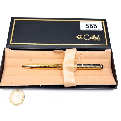 588 - A calibri ballpoint pen with gold tone finish in original box.