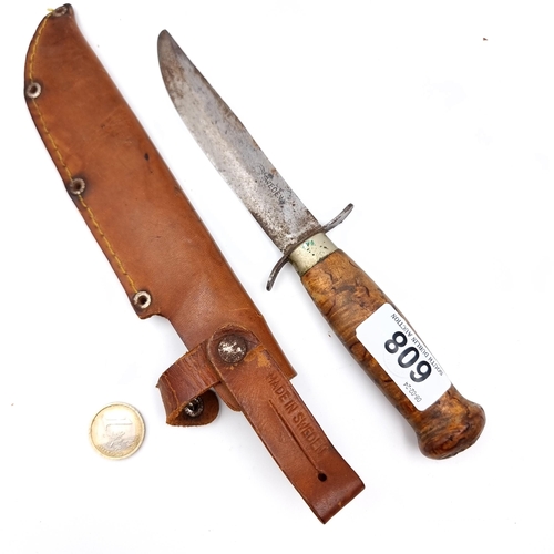 608 - A Swedish made hunting knife with polished wooden handle, length of knife 22cm, comes with Swedish l... 