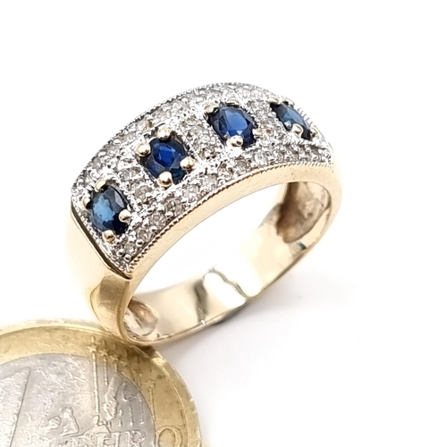 615 - Star Lot : A very good quality hallmarked 9K gold sapphire ring with diamond cluster, ring size P, w... 