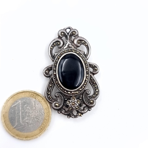 619 - A pretty vintage onyx brooch with marcasite foliate design set in sterling silver, weight 11.87 gram... 