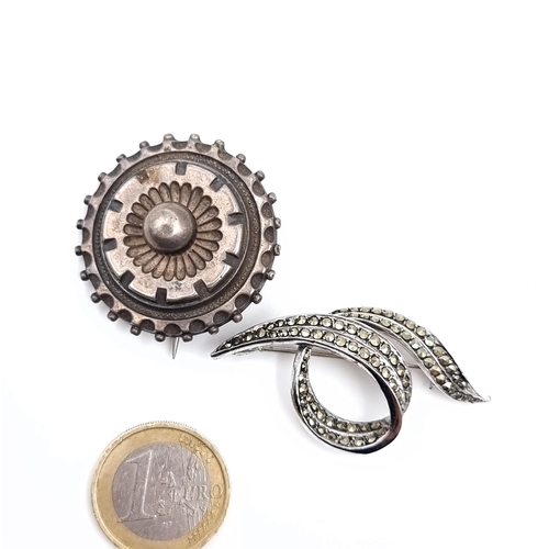 621 - Two vintage brooches including a silver and marcasite leaf example, weight 8.15 grams, pin intact to... 