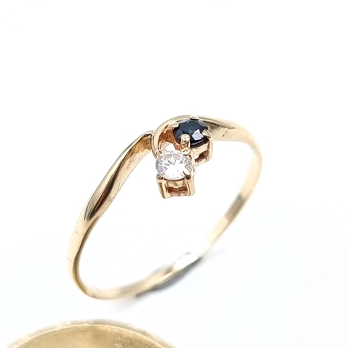 622 - Star Lot : A lovely 9K gold hallmarked ring with diamond and sapphire setting, weight 1.29 grams, si... 