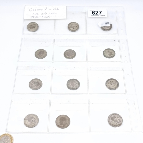 627 - A collection of Sterling Silver 12 George the V one shilling silver coins, C.1910-1936.