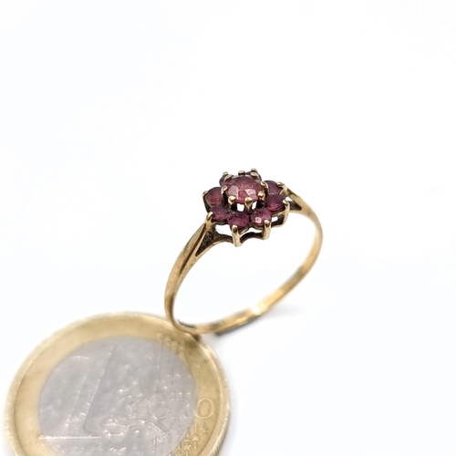 637 - A 9K gold garnet cluster ring, ring size N, weight 1.15 grams.