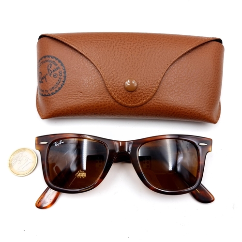 657 - A pair of unused RayBan wayfarer sunglasses with faux tortoise shell frames in original case, togeth... 