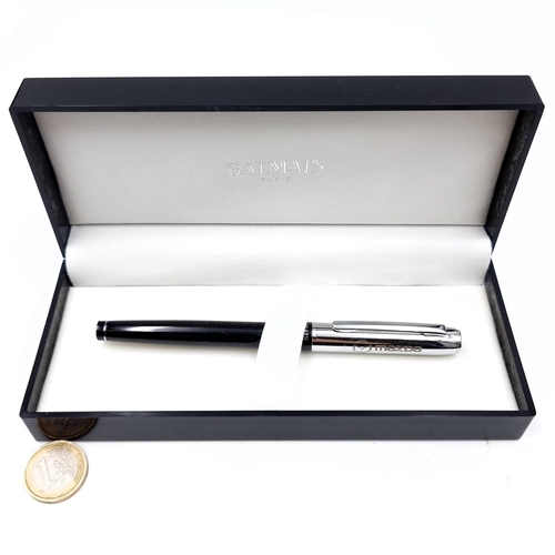 658 - A Balmain of Paris boxed ballpoint pen in unused condition set with Mazda insignia.