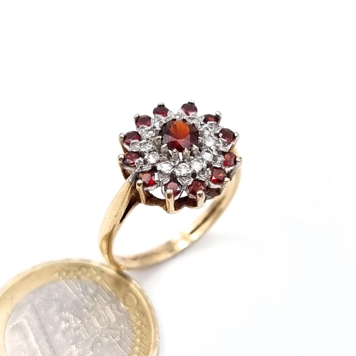 668 - A vintage 9K gold garnet and gemstone cluster ring hallmarked Birmingham, size R, weight 3.6 grams, ... 