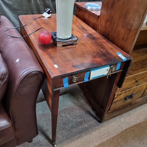 679 - Star Lot : A stunning antique Pembroke table with drawer to front boast brass handles, held on slend... 