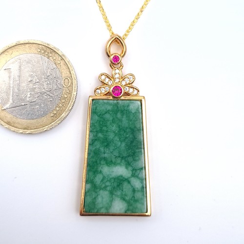 11 - Star Lot : A nice example of an 18K marked Au750, Jade pendant necklace set with rubies, length of c... 