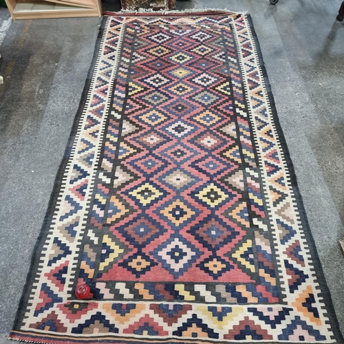 688 - A fabulous mid century hand knotted woolen rug / runner in a vibrant geometric pattern in shades of ... 