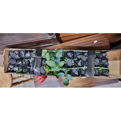 694 - A box of artificial long Black roses in the original box. Would be a Nic romantic gesture for a Goth... 