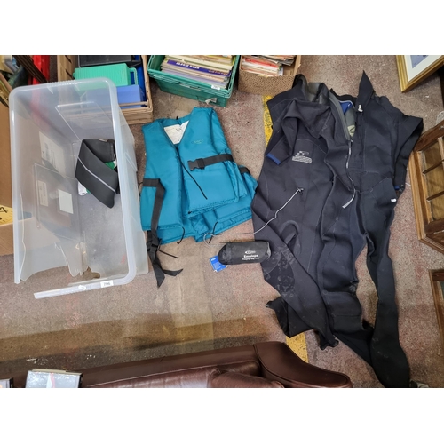 706 - Four items including a 'JP McManus Invitational Pro Am' hat, two wetsuits both with detachable arms,... 