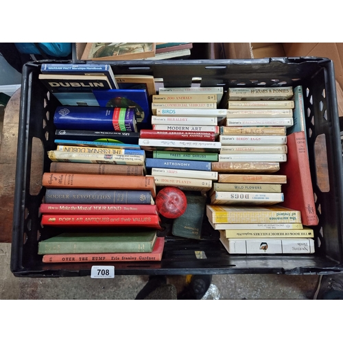 708 - A crate filled with a large collection of books on a variety of subjects with a dozen or so observer... 