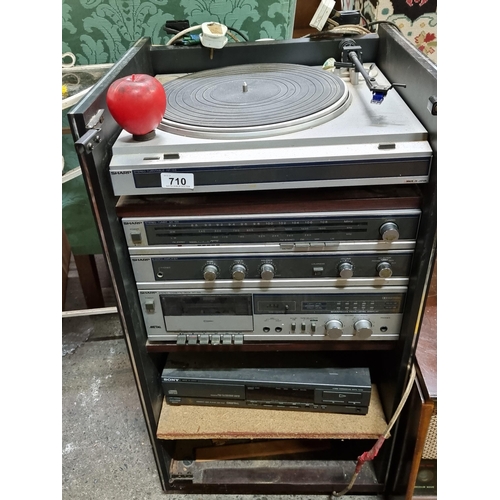 710 - A super vintage Sharp stereo sound system consisting of a turntable with needle RP-155, tuner SA-155... 