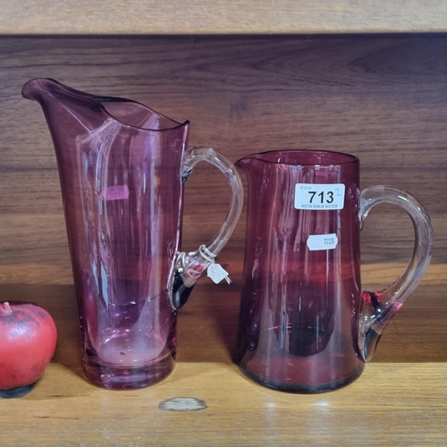 713 - Two gorgeous antique cranberry glass pitchers, great mid century feel. Crack to larger example, does... 