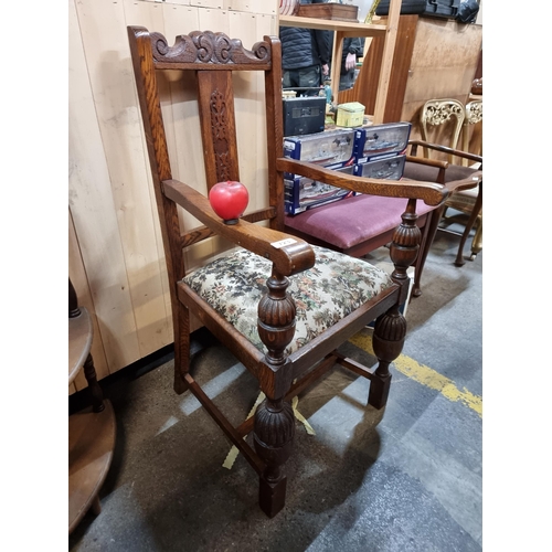 723 - A fabulous antique oak carver chair with exquisite carving and turning throughout, upholstered in a ... 