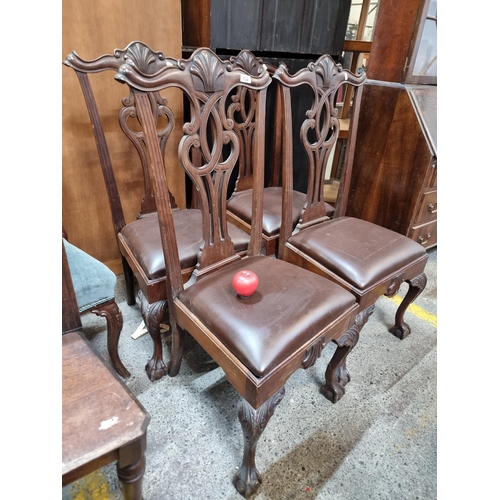 732 - A wonderful set of four antique dining chairs with high backs boasting scroll and scallop shell moti... 