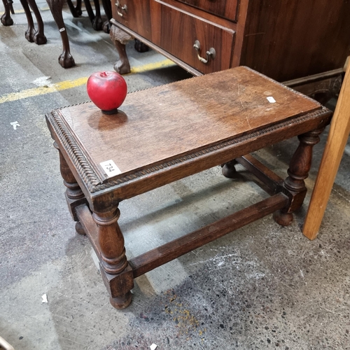 734 - A charming antique carved oak bench with fine rope twist detail to edge, held on nicely turned bobbi... 