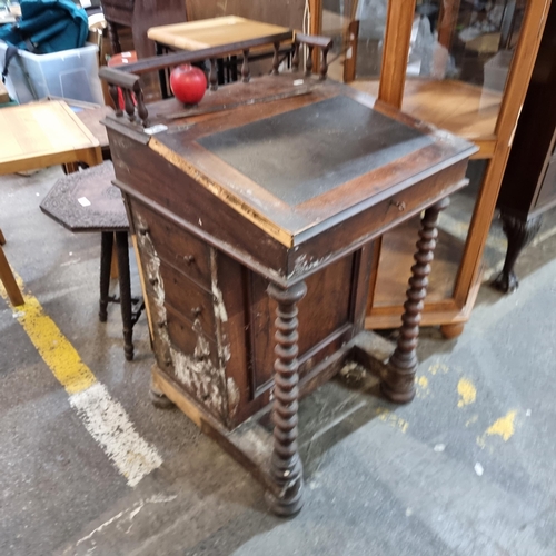 738 - An antique 19th century writing desk / bureau with spindle gallery back, leather writing slop which ... 