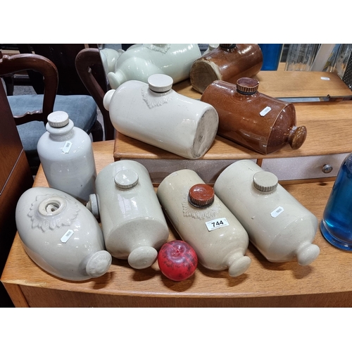 744 - Seven vintage ceramic hot water bottles in a variety of shapes and sizes.