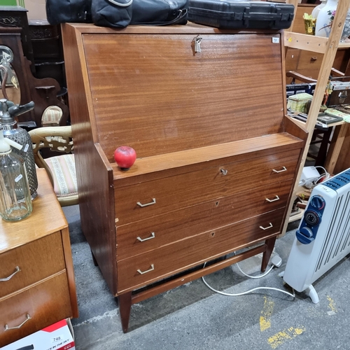 751 - Star Let : A super mid century writing bureau, with three drawers and fitted interior.  Info vendor ... 