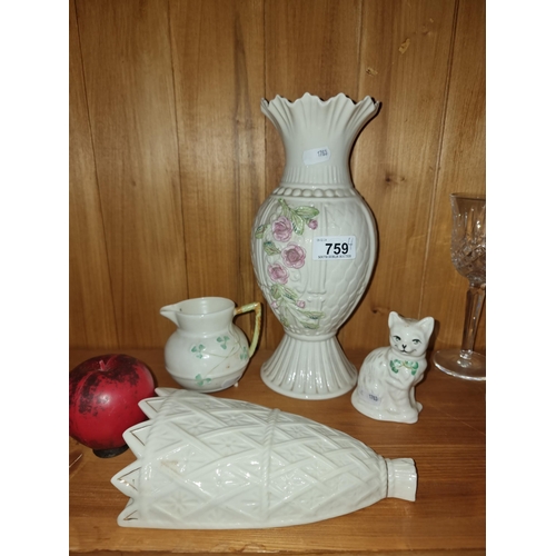 759 - Four pieces of belleek including a cat and wall pocket.