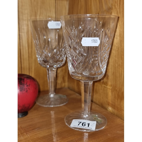 761 - A pair of Waterford Crystal stemmed glasses. In good order with acid mar to base.