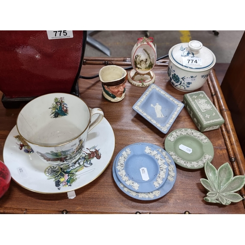 774 - Eleven pieces of ceramics including a miniature Toby jug and five pieces of Wedgwood and a huge over... 