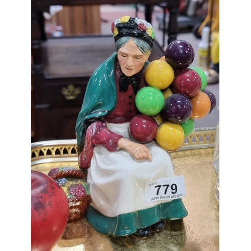 779 - A Royal Doulton figure figure titled 'The Old Balloon Seller'. In very good condition.