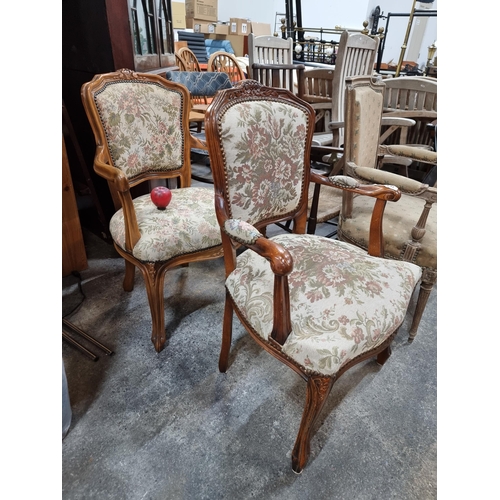 787 - Two beautiful vintage French style armchairs boasting pretty floral upholstery.