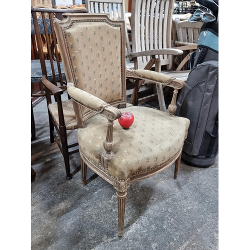 788 - Star lot : A fantastic vintage French reading chair featuring reeded tapered legs. In lovely conditi... 