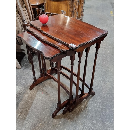 793 - A gorgeous set of vintage mahogany nesting tables.