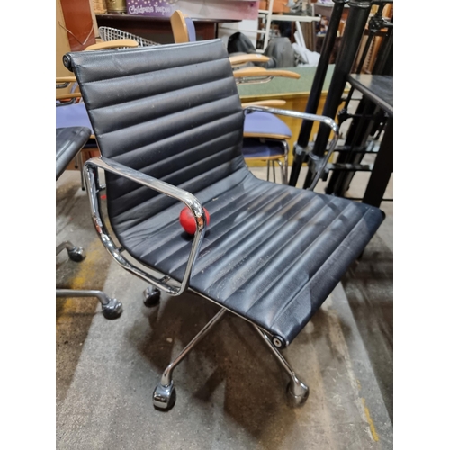 805 - A stylish IFC  Charles Eames black leather leather office chair featuring a chrome base and set on c... 