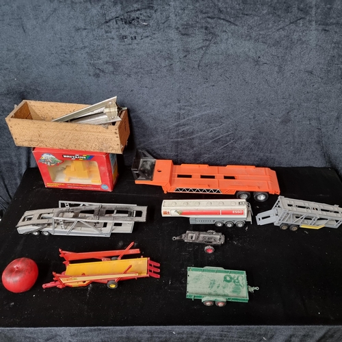 937 - A box containing a selection of collectible vehicle parts