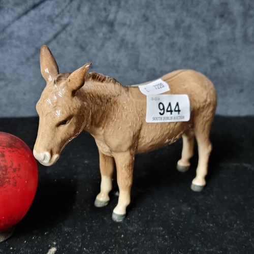 944 - A adorable Beswick porcelain figure of a donkey.