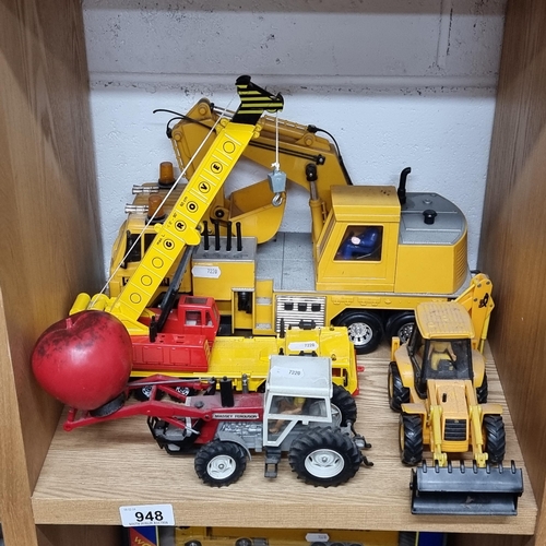 948 - Four children's toys including a Massey and Ferguson tractor and a JCB digger.