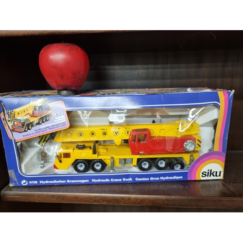 953 - A new in box model of a Siku hydraulic crane truck.