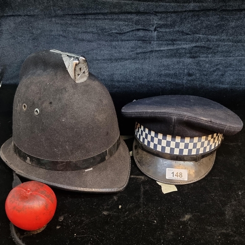 148 - Two British metropolitan policeman's cap and hard hat.