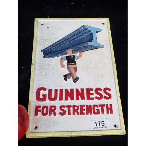 175 - A cast metal advertising plaque for Guinness reading 'Guinness for strength'.