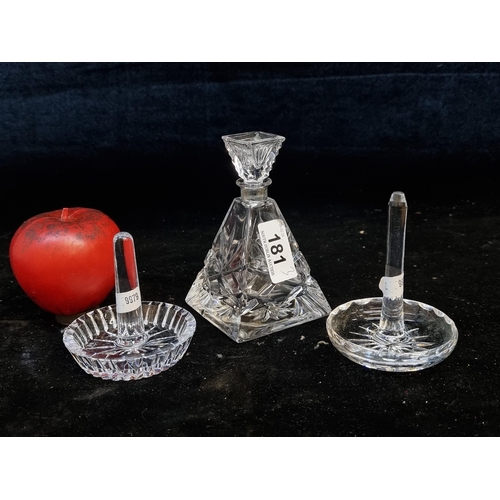 181 - Three crystal items including a Galway crystal perfume bottle and two ring dishes.