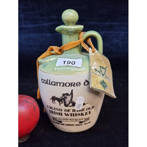 190 - A vintage Tullamore Dew whiskey crock with original tag (empty).